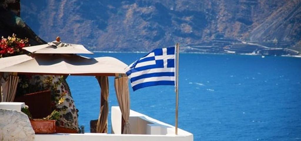 How much did Greek tourists spend in Greece? 